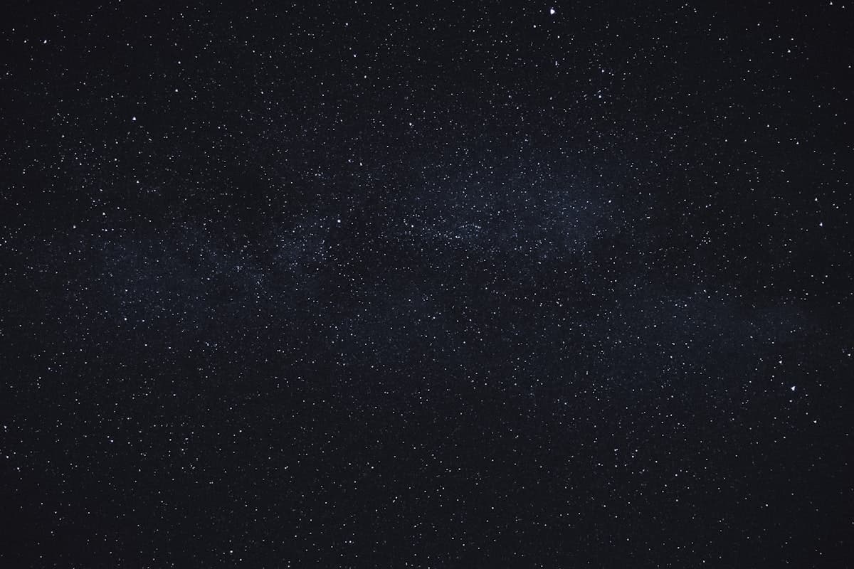 A dense, glowing field of stars across the night sky