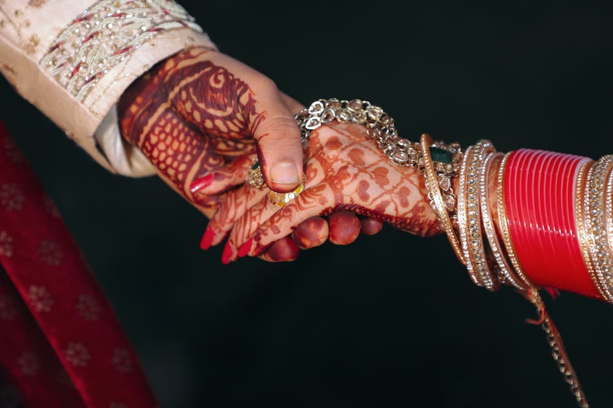 Hands adorned with henna, symbolizing marriage compatibility